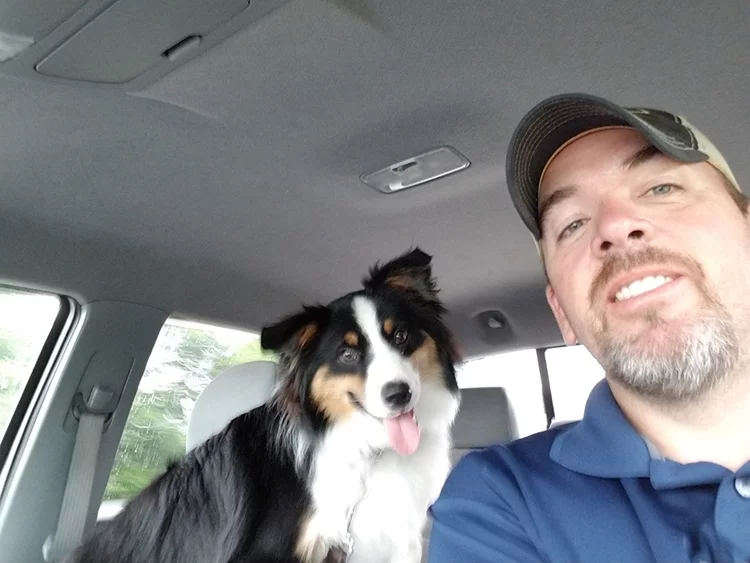 dog owner in car